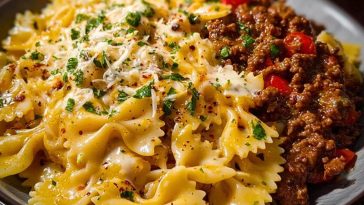 Cheesy Bowtie Pasta with Savory Cajun Ground Beef in Garlic Cream