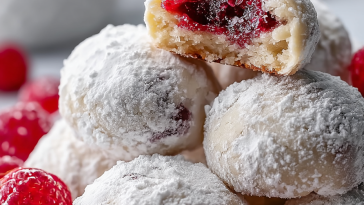 Raspberry Filled Almond Snowball Cookies